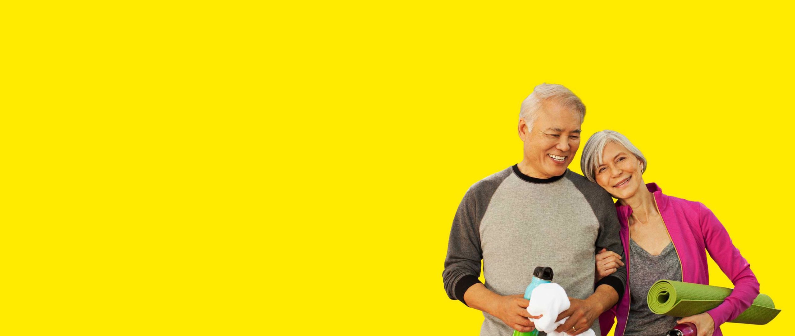 Asian-couple-wearing-Interton-hearing-aids-smiling-hero